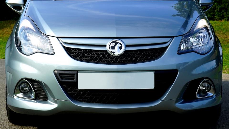 Silver compact hatchback with clean front panels after repair