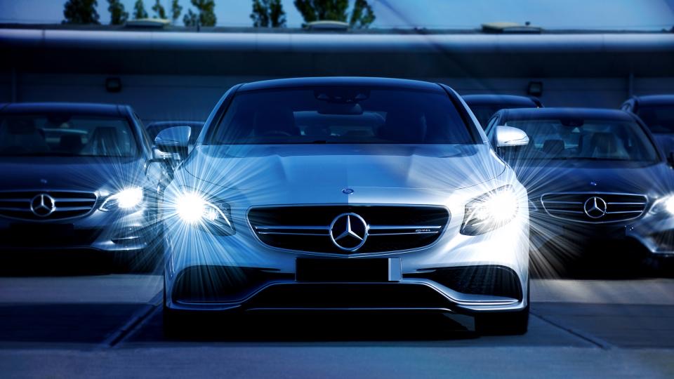 Silver sedan photographed at night with clean panels